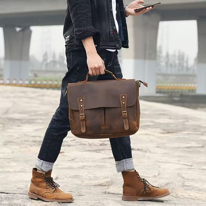 Vintage Genuine Leather Men's Briefcase, featuring an adjustable shoulder strap, gold-tone hardware, and a zippered closure.