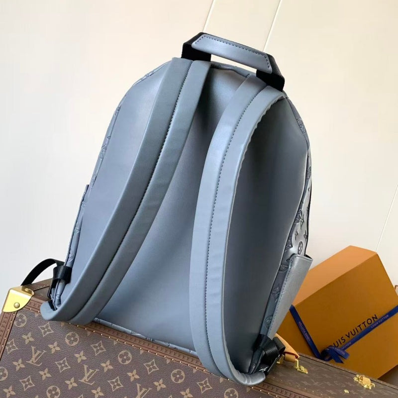 Grey embossed cowhide backpack, featuring metal hardware that exudes a refined, understated air.
