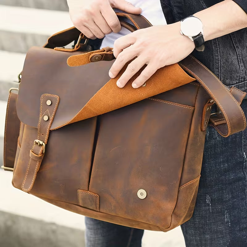 Vintage Genuine Leather Men's Briefcase, featuring an adjustable shoulder strap, gold-tone hardware, and a zippered closure.