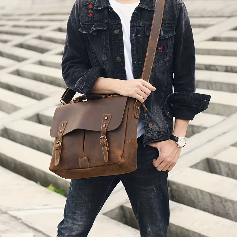 Vintage Genuine Leather Men's Briefcase, featuring an adjustable shoulder strap, gold-tone hardware, and a zippered closure.