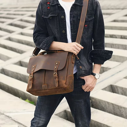 Vintage Genuine Leather Men's Briefcase, featuring an adjustable shoulder strap, gold-tone hardware, and a zippered closure.