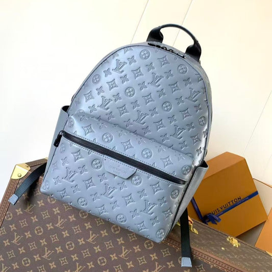 Grey embossed cowhide backpack, featuring metal hardware that exudes a refined, understated air.